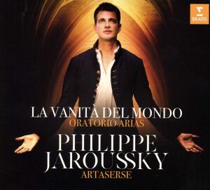 A portrait of Philippe Jaroussky before the illuminated interior of a church